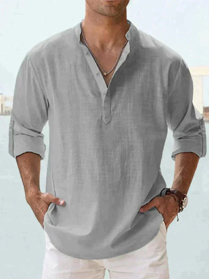 Classic men's relaxed fit button-down summer shirt. Long sleeve, casual, ideal for warm weather vacations.