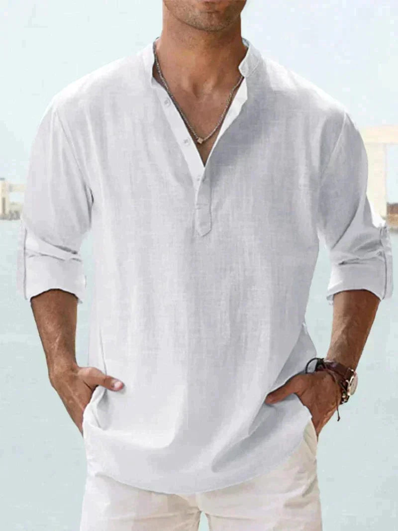 Man wearing a relaxed fit button-down summer shirt. Casual style for beach vacations & warm weather activities.