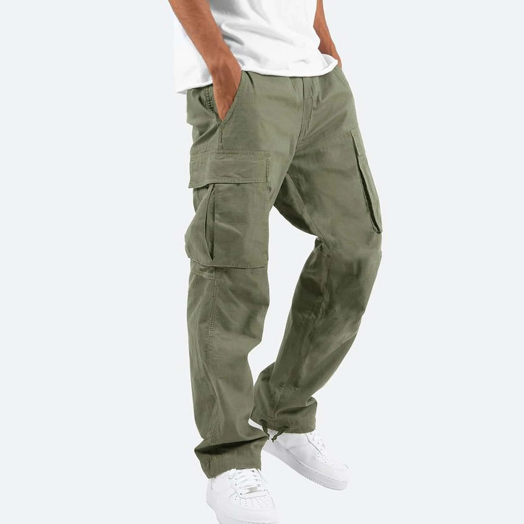 Men's relaxed fit cargo pants in a dark color on a model, highlighting the side pockets for practical use.