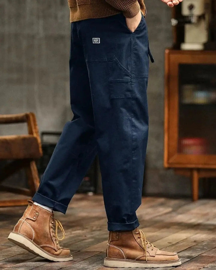 Man in comfortable relaxed fit cargo pants with multi-pockets, showcasing casual and functional style.