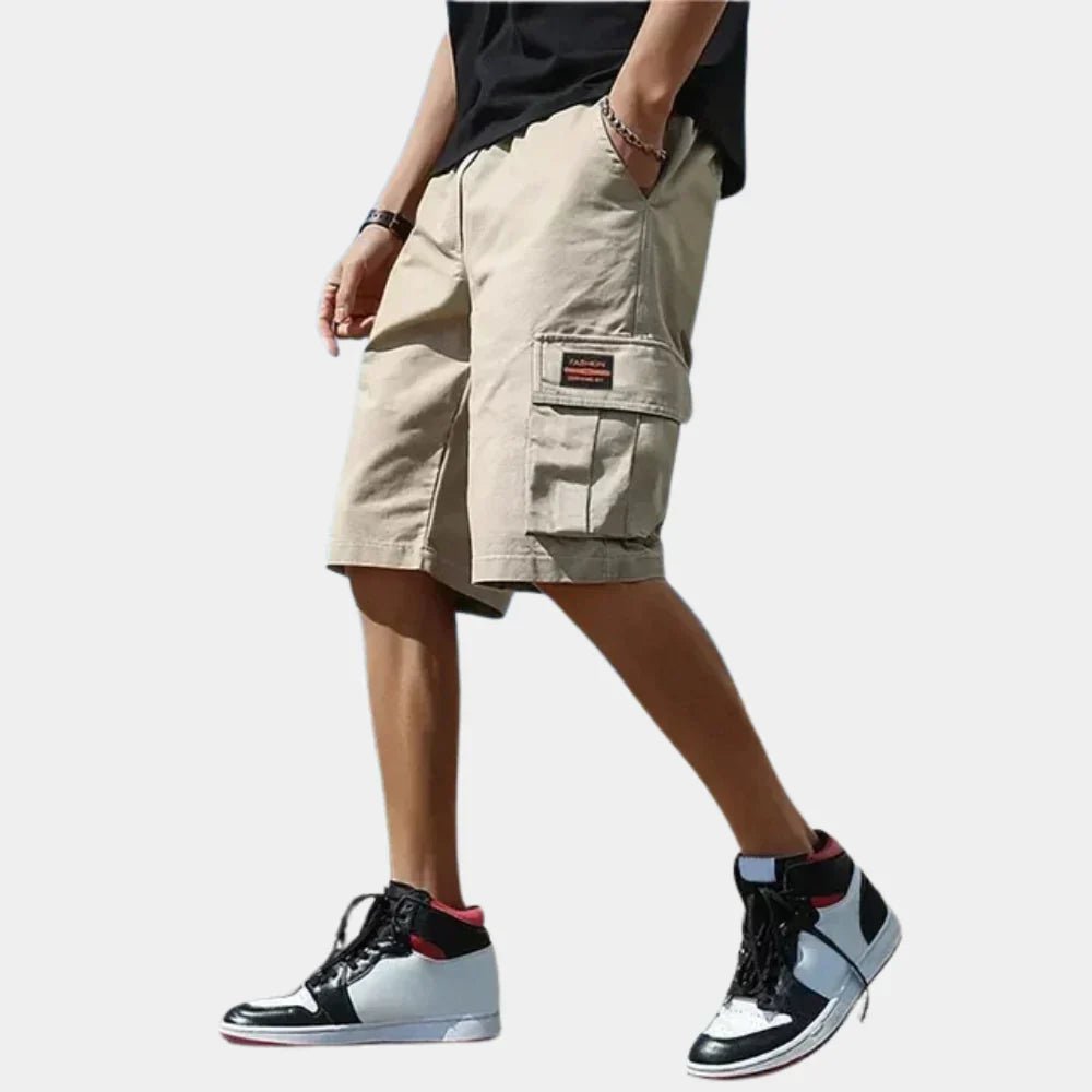 Men's multi-pocket utility cargo shorts, adjustable for travel and outdoor comfort. Relaxed fit.