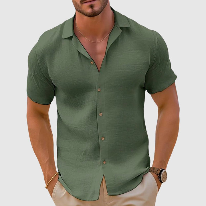 Summer men's short sleeve collared shirt featuring a relaxed fit for warm weather comfort.
