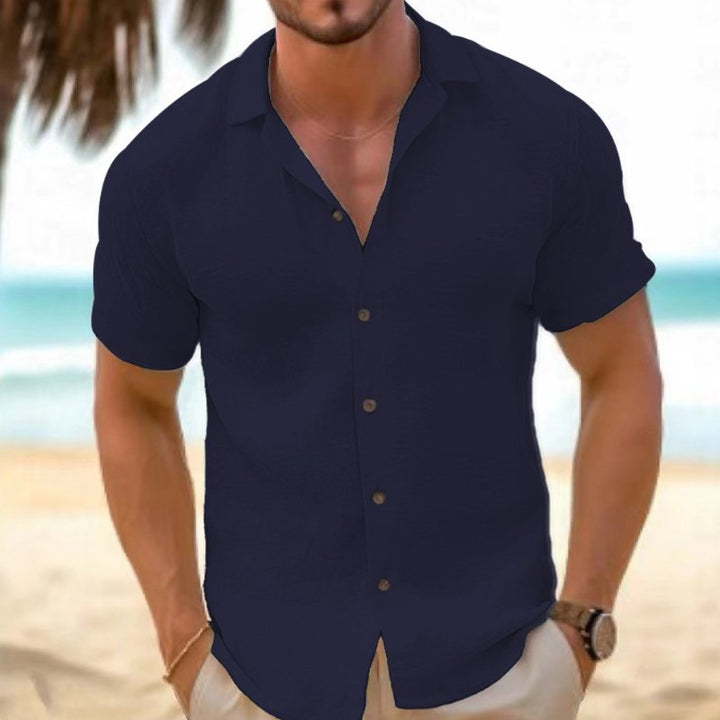 Versatile men's short sleeve collared shirt with a relaxed fit, perfect for casual or travel.