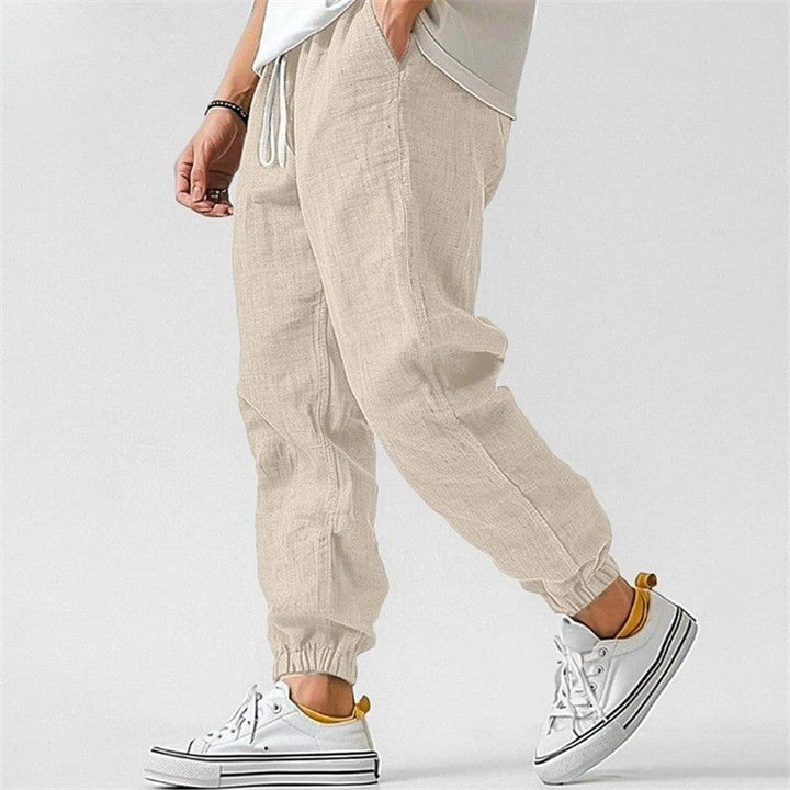 Effortless men's fashion: relaxed fit cuffed joggers, perfect for stylish comfort & contemporary streetwear.