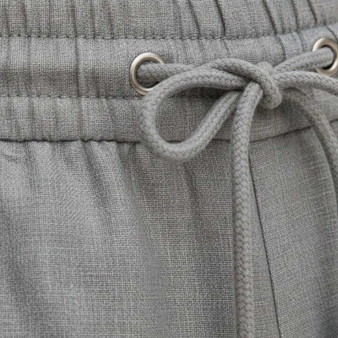 Man wearing comfortable men's relaxed fit drawstring summer shorts, ideal for casual outdoor activities.