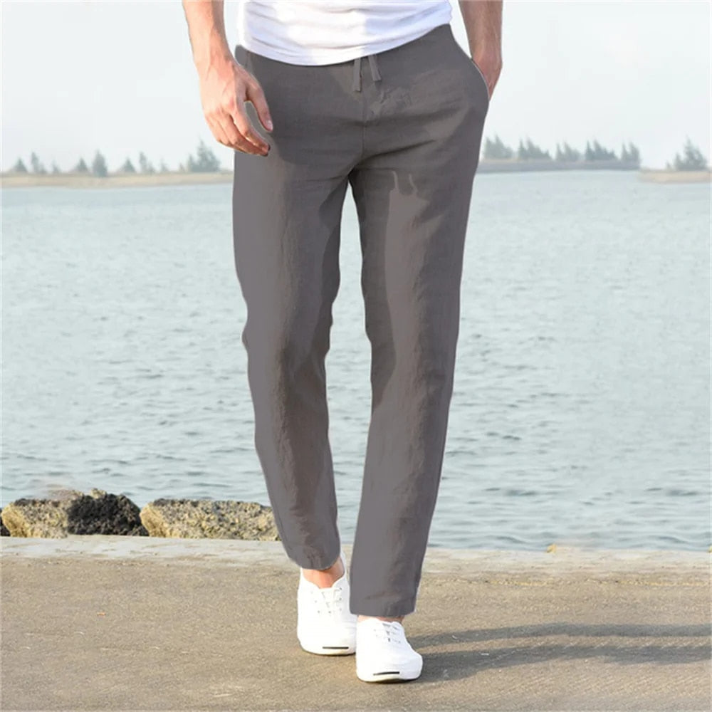 Comfortable men's travel pants, relaxed fit with drawstring & pockets, great for warm weather adventures.