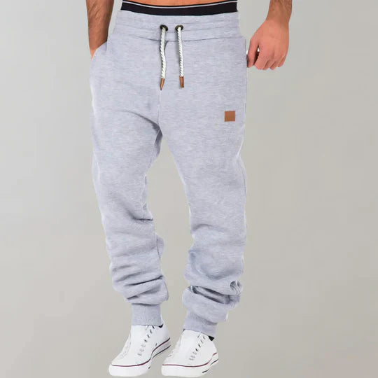 Dark grey men's activewear sweatpants with drawstring, perfect for gym, lounging, or casual everyday wear.