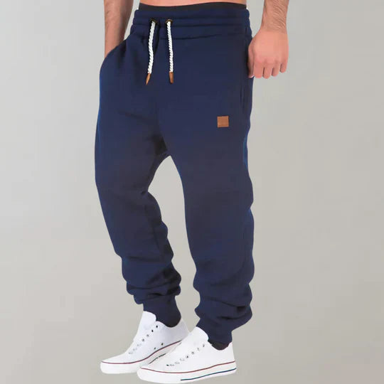 Stylish men's black jogging pants, ideal for athletic activities, casual outings, or relaxed loungewear.