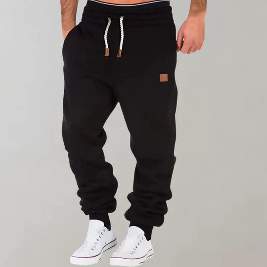 Comfortable men's athletic pants with a relaxed fit, great for fall & winter activewear or casual comfort.