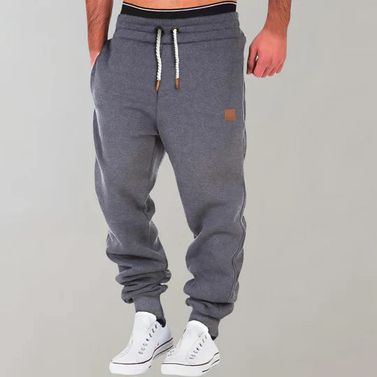 Close-up of comfortable men's drawstring sweatpants, perfect for jogging, gym, or ultimate everyday relaxation.