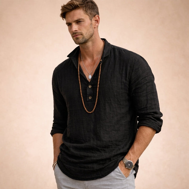 Blue men's relaxed fit long sleeve button-down shirt. Stylish & breathable for summer fashion and resort wear.
