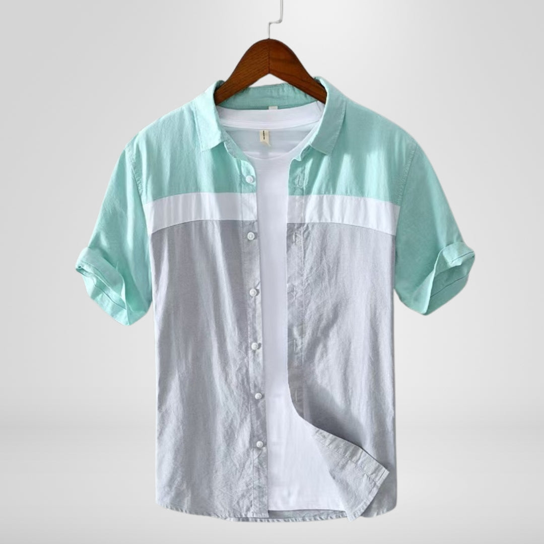 Short sleeve men's summer shirt, relaxed fit, featuring unique contrast panels for a modern casual style.