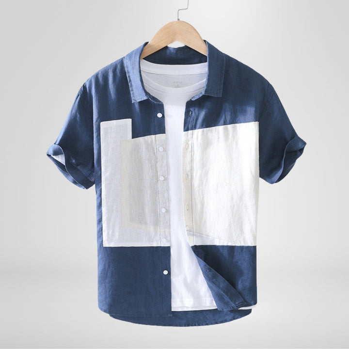 Stylish men's casual relaxed fit shirt with eye-catching contrast panels, short sleeve, for a modern summer look.