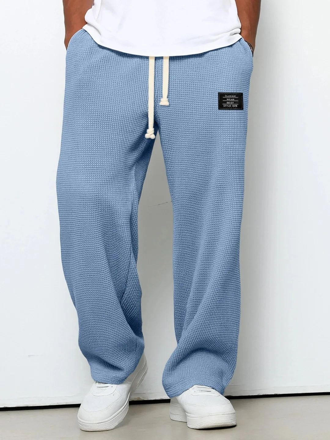 Men's relaxed fit waffle knit lounge pants with drawstring for ultimate comfort & casual home wear.