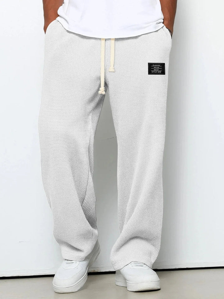 Soft men's waffle knit lounge pants. Drawstring waist & relaxed fit provide comfort for home or casual use.