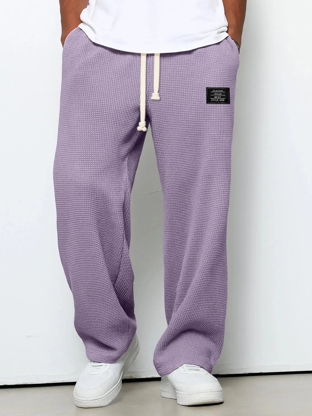 Men's comfortable waffle knit loungewear pants. Relaxed fit drawstring trousers for ultimate casual comfort.
