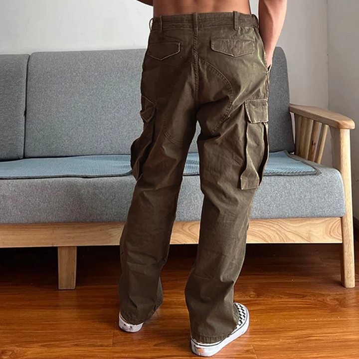 Close-up of durable washed chino fabric on men's relaxed fit cargo pants, ensures comfort for daily use.