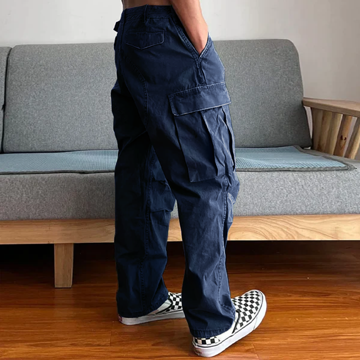 Model in men's relaxed fit washed chino cargo pants, demonstrating comfortable fit for everyday style.