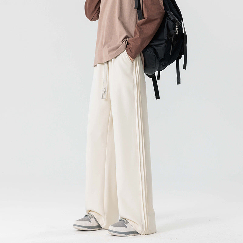 Men's casual wide leg drawstring pants with trendy side stripe for a modern style.