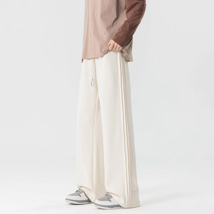 Relaxed fit men's wide leg drawstring trousers, ideal for comfort in casual outfits.