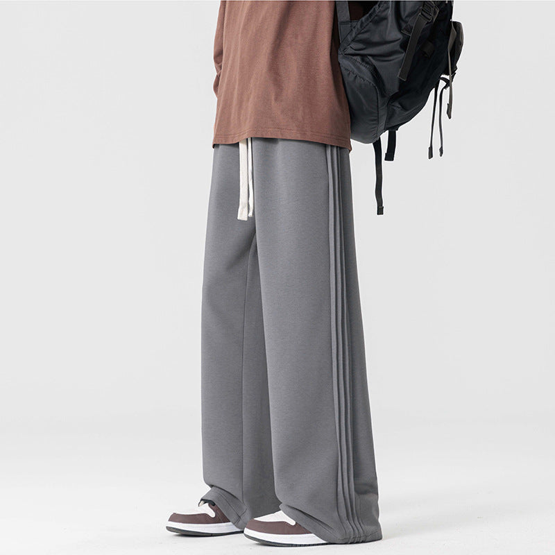 Men's comfortable chino style wide leg drawstring pants with a loose casual fit.