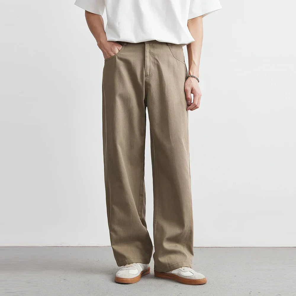 Men's relaxed fit wide leg khaki utility pants, perfect for comfortable casual everyday wear.