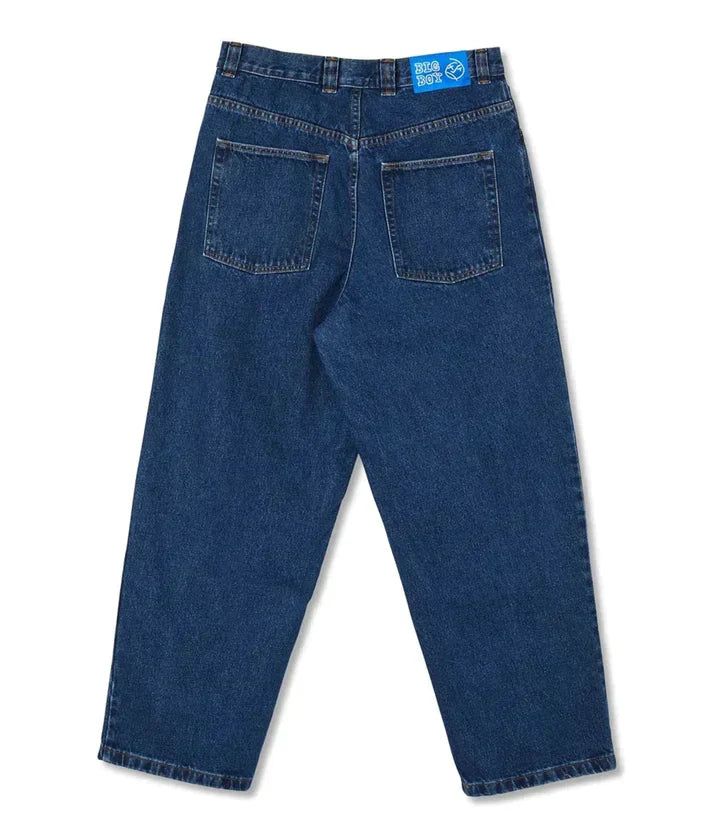Side profile of men's wide-leg denim pants, highlighting the relaxed silhouette and modern streetwear style.