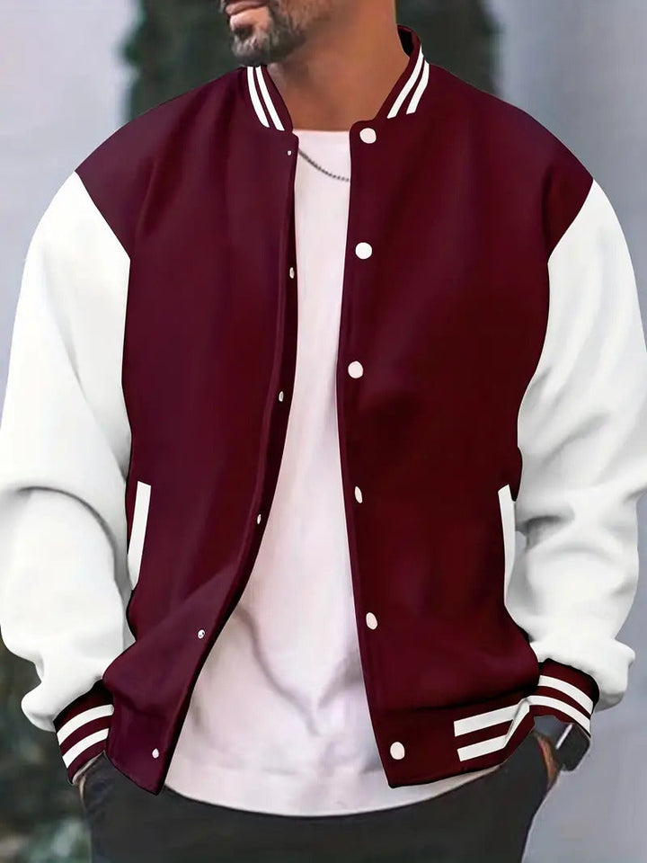Close-up of a men's casual varsity jacket showcasing the detailed letterman patch and wool fabric