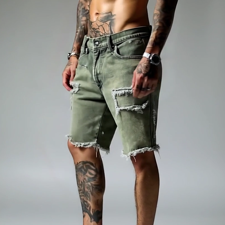 Close-up of men's ripped stretch denim shorts. Distressed details, comfortable fabric, straight leg, perfect for summer.