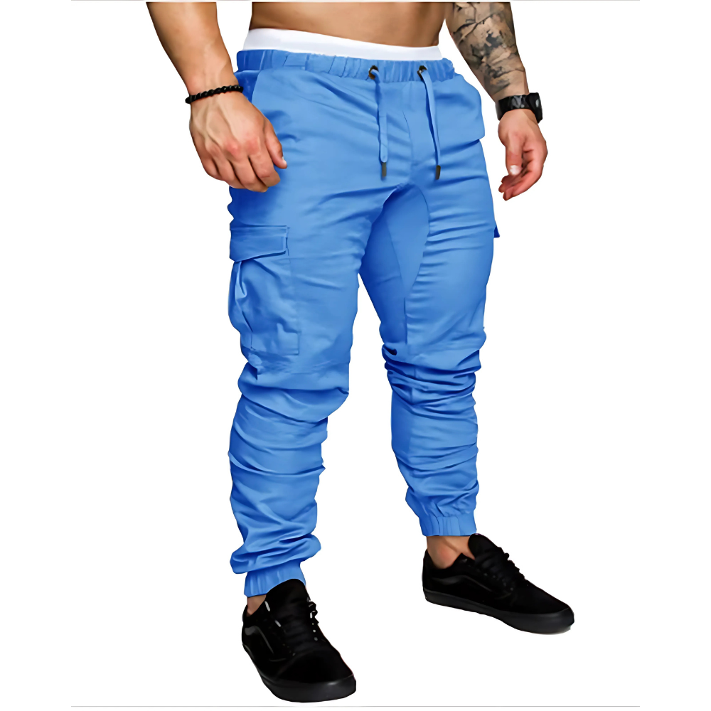 Model wearing men's multi-pocket cargo joggers with casual top, ideal for urban street style & comfort.