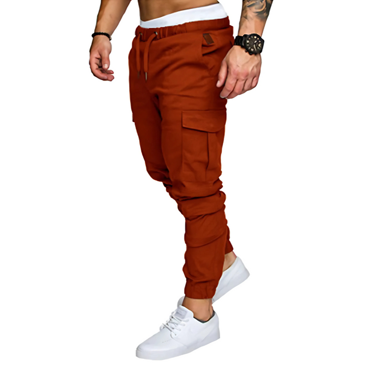 Elastic waistband detail on men's multi-pocket cargo joggers, ensuring a comfortable & secure fit.