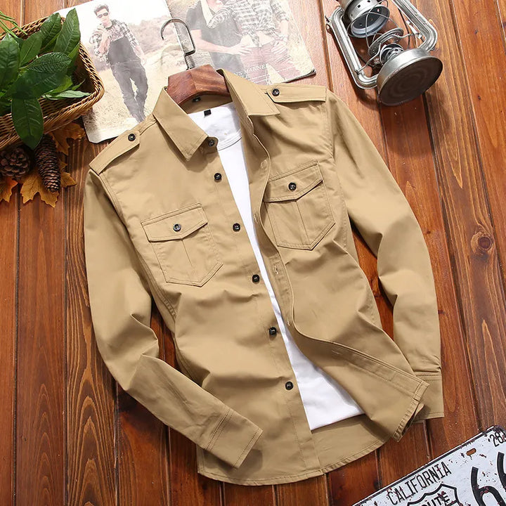 Men's rugged tactical shirt with epaulettes & utility chest pockets. Button-down, military style for outdoor wear.