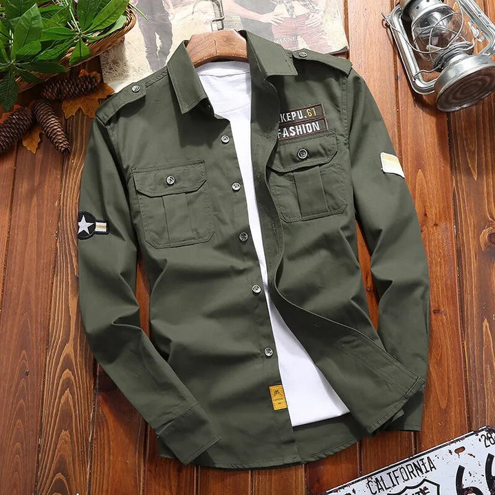 Army green men's military style tactical shirt. Features epaulettes, twin utility pockets & a comfortable fit.