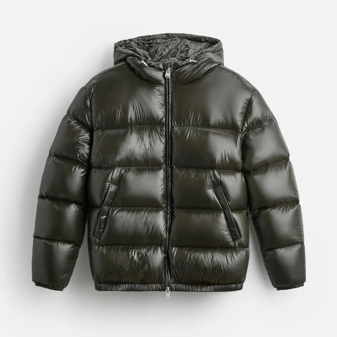 Close-up of shiny black men's puffer jacket with quilted detailing and a warm hood, winter essential