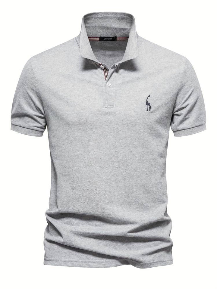 Distinctive men's short sleeve polo shirt featuring a charming embroidered giraffe for golf & casual.