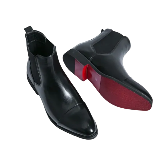 Men's sleek black Chelsea boots with elastic panels for easy slip-on style, perfect for dress or casual wear.