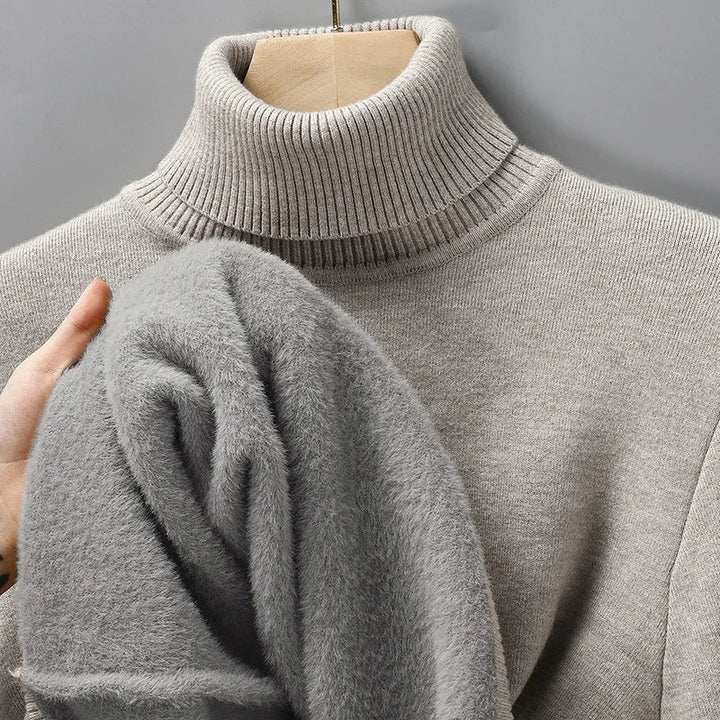 Sleek sculpted men's knit turtleneck sweater, offering a modern, classic fit for sophisticated winter fashion.