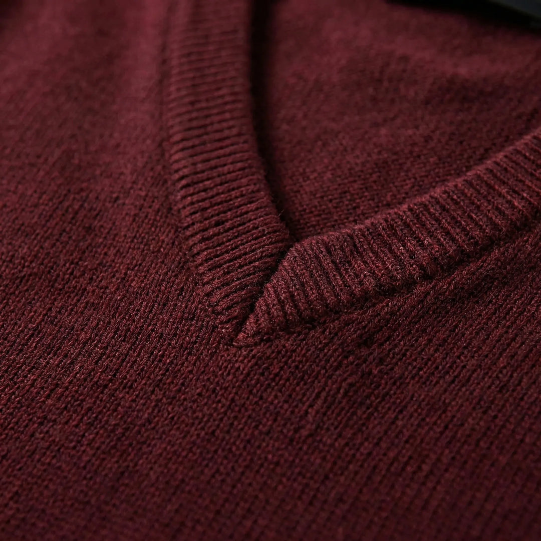 Close-up of men's sleeveless V-neck vest, highlighting the knit texture and modern cut.