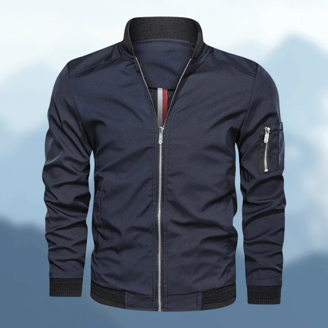 Trendy men's slim fit bomber jacket in navy blue, side view, lightweight casual outerwear.