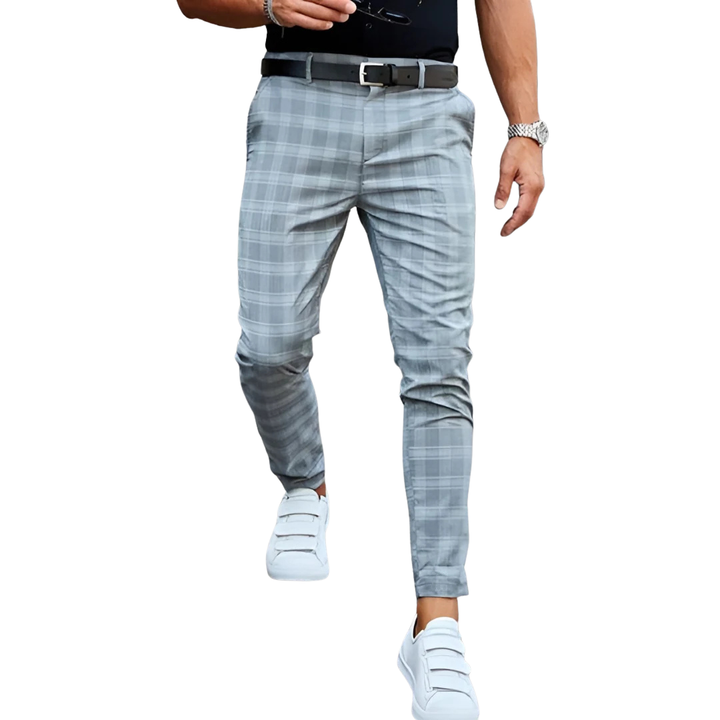 Stylish men's slim fit cropped pants with a chic checked pattern, ideal for modern fashion.