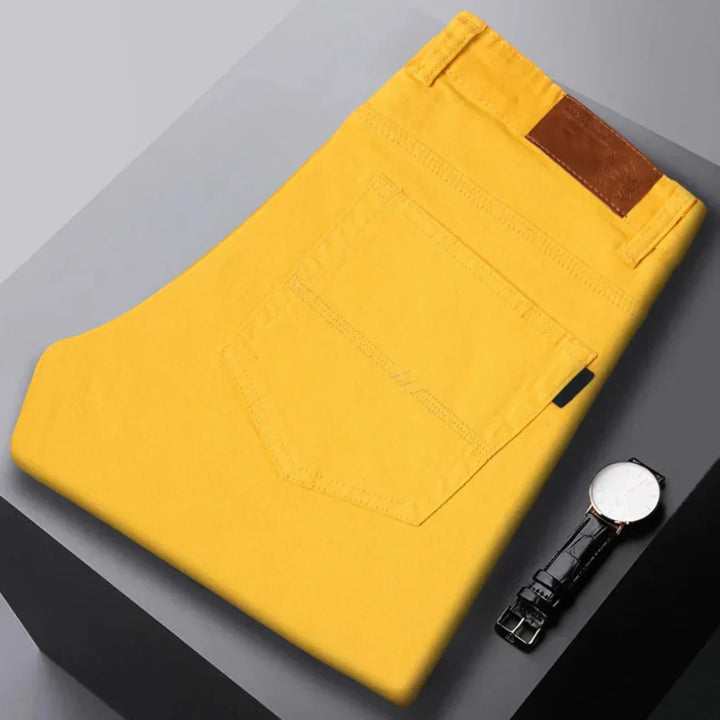 Close-up of modern men's slim fit denim jeans, showcasing tailored design & quality denim fabric for casual wear.