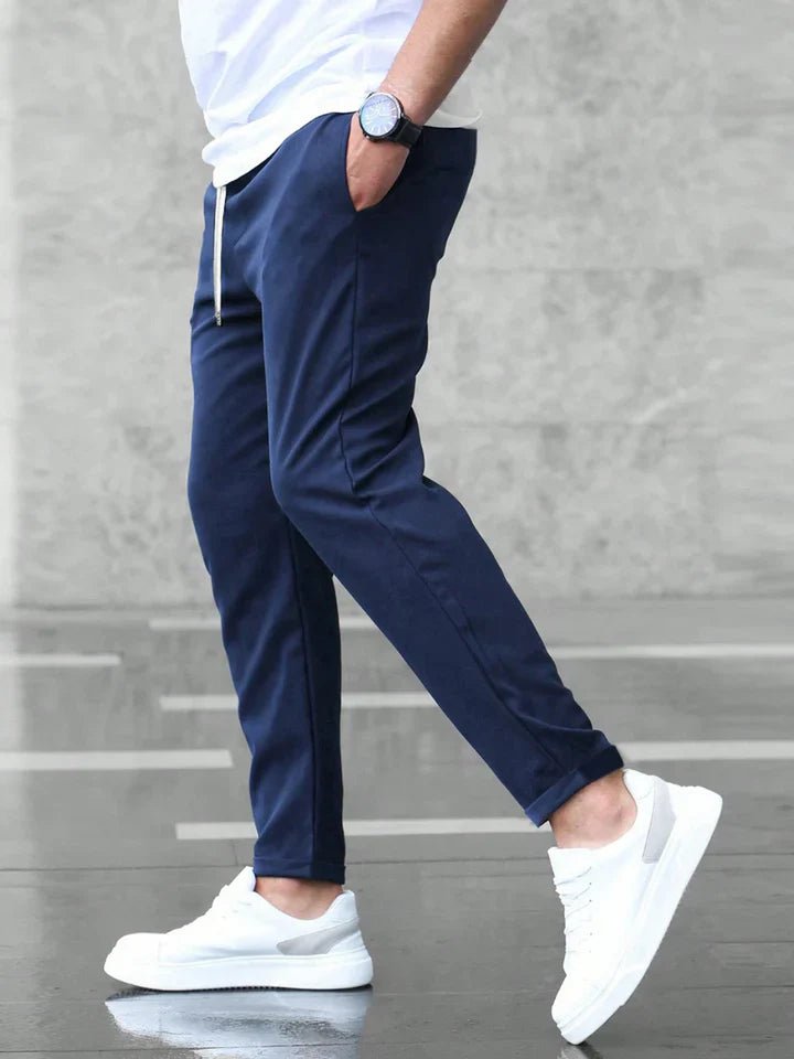 Comfortable slim fit chino pants for men with drawstring waist, perfect for flexible wear.