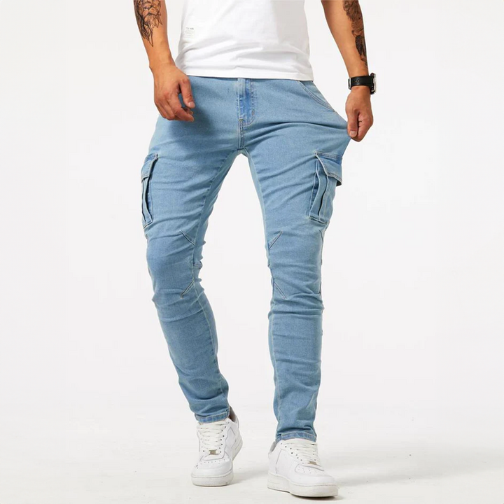 Close-up of men's blue slim fit cargo pants, featuring practical multi-pocket design & stylish utility.