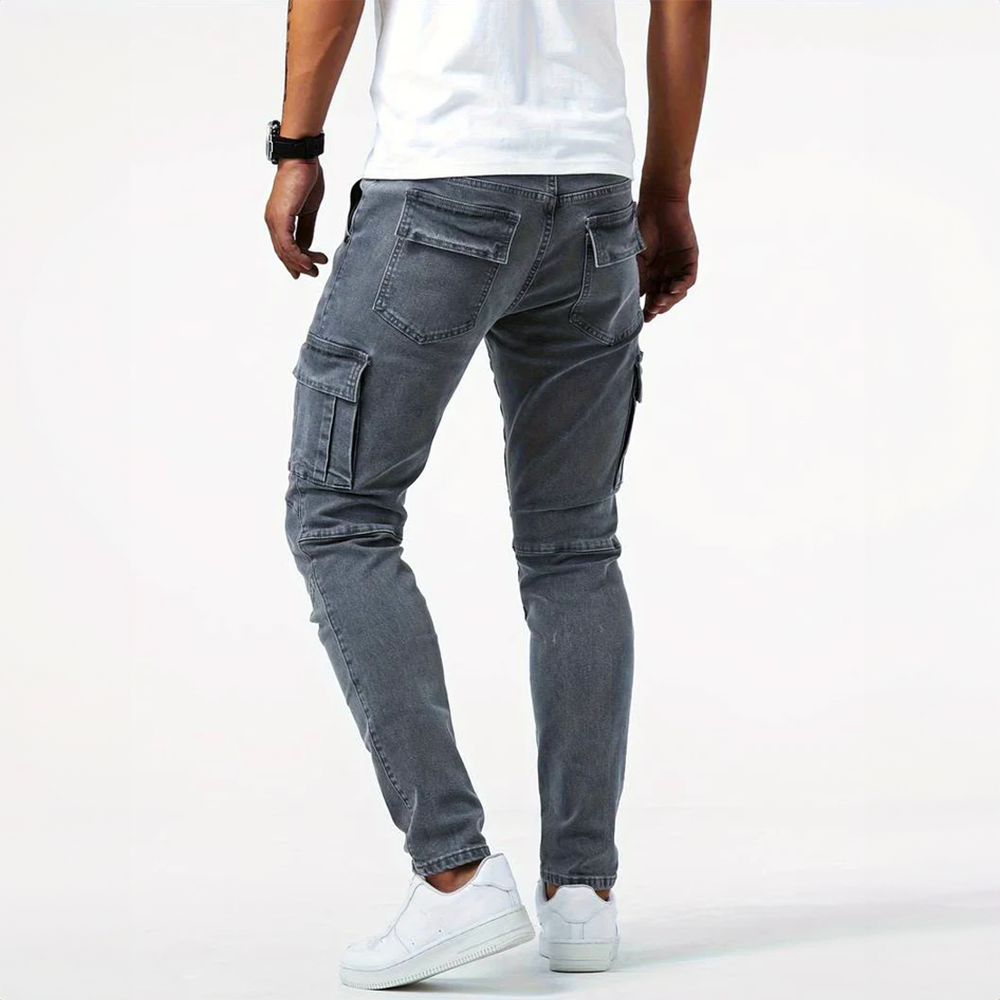 Detail of the side flap pocket on men's gray slim fit cargo pants, showing modern design.