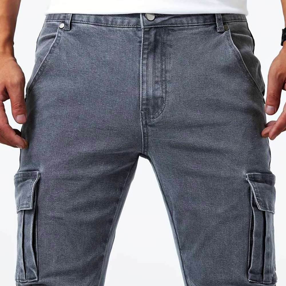 Man wearing modern slim fit blue cargo pants, showcasing casual everyday comfort & style.