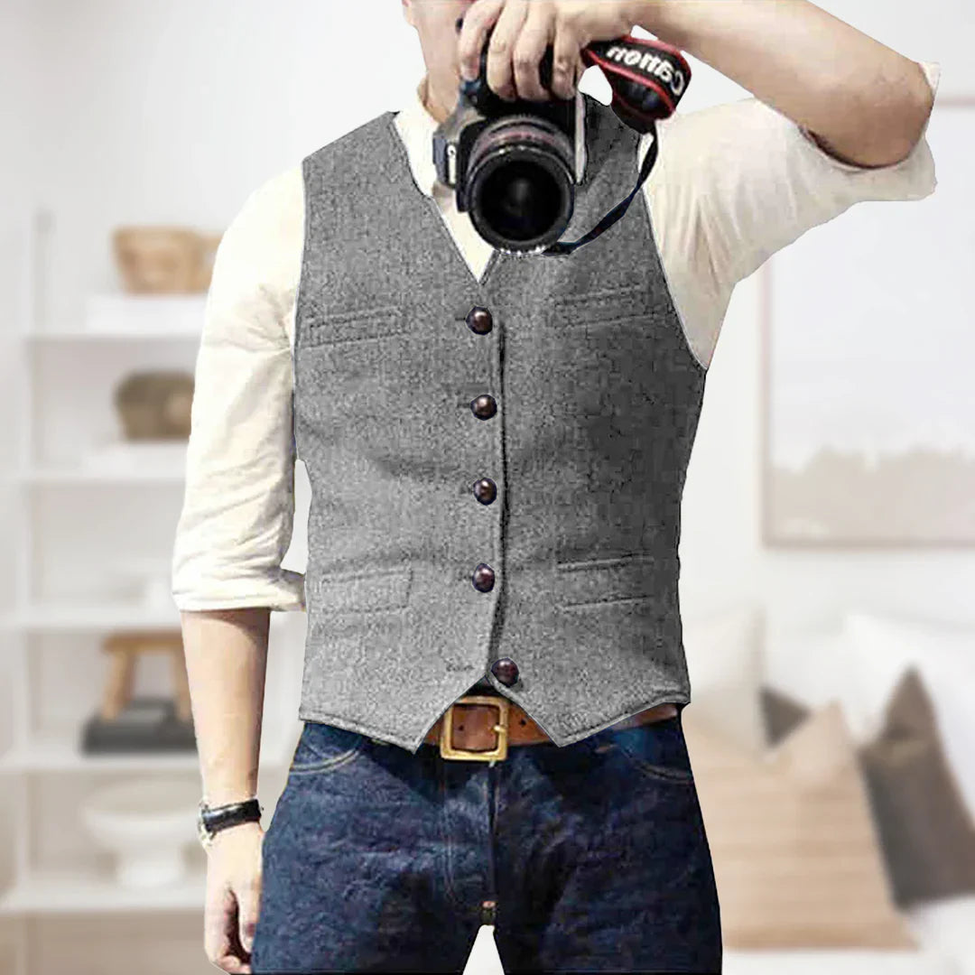 Elegant slim fit men's herringbone tweed waistcoat, business casual layering piece.