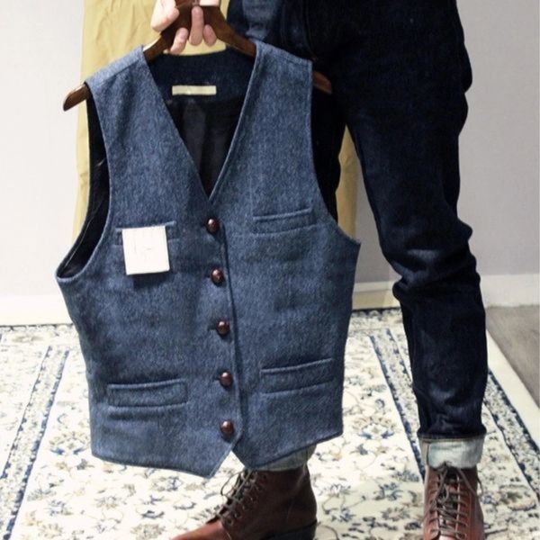Sophisticated men's slim fit herringbone tweed waistcoat, classic design.