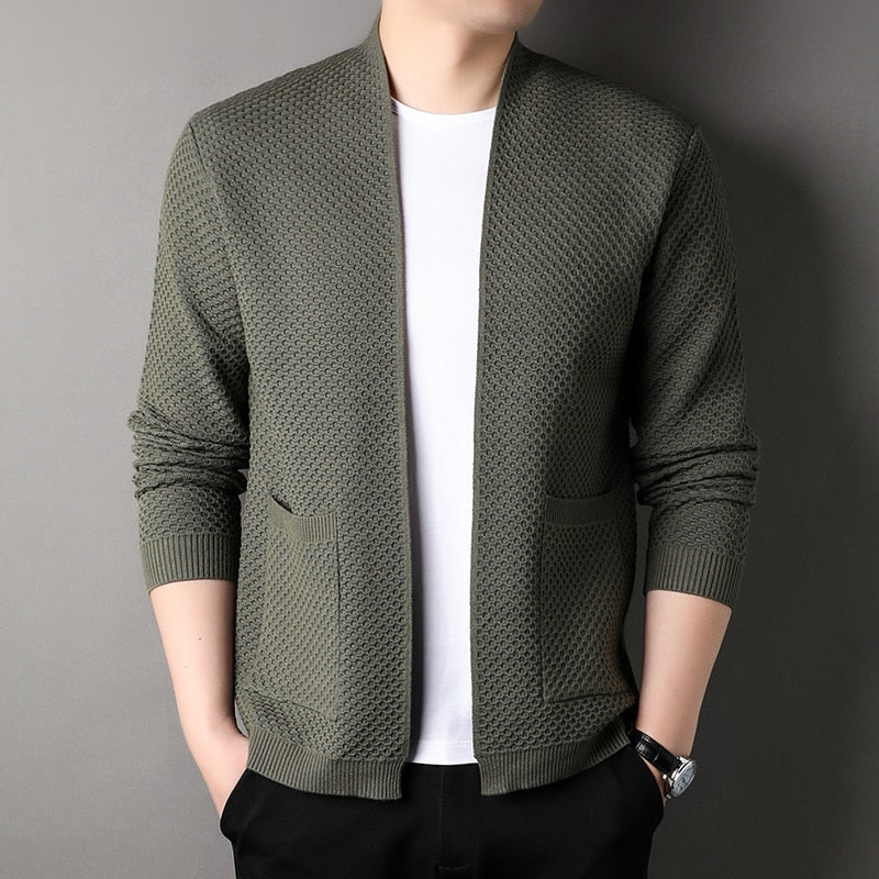 Full shot of a men's slim fit knitted cardigan, showcasing its modern design and pockets.