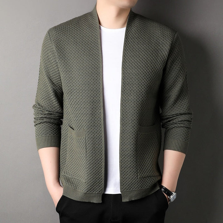 Full shot of a men's slim fit knitted cardigan, showcasing its modern design and pockets.