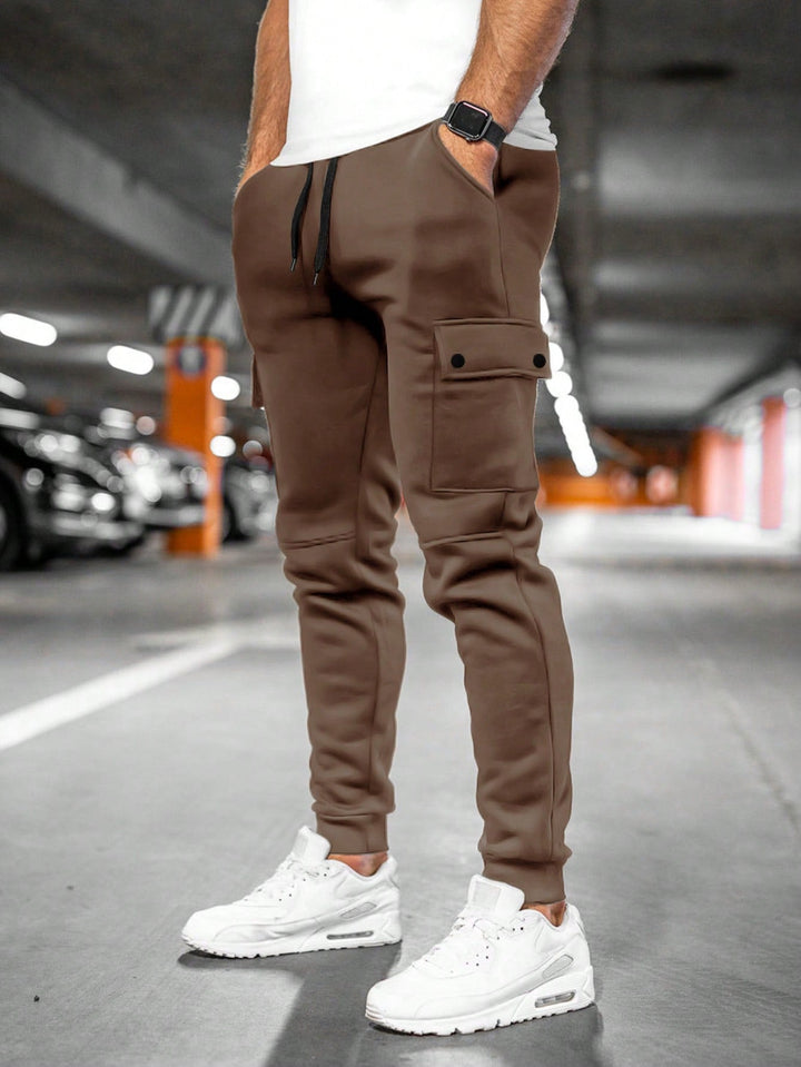 Tapered leg men's slim-fit joggers in a modern streetwear style, perfect for casual wear.